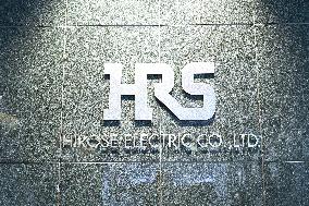 HIROSE ELECTRIC CO., LTD. (HRS) signage, logo